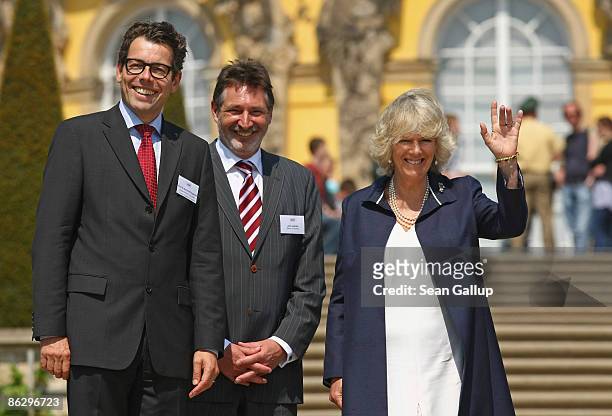 Camilla, Duchess of Cornwall, accompanied by Hartmut Dorgerloh , Director of the Foundation of Prussian Palaces and Gardens, and Jann Jakobs, Mayor...