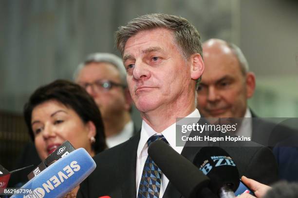 Outgoing Prime Minister Bill English speaks while wife Mary looks on during a National Party press conference at Parliament on October 19, 2017 in...