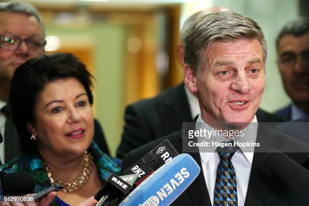 Outgoing Prime Minister Bill English speaks while deputy Paula Bennett looks on during a National Party press conference at Parliament on October 19,...