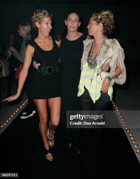 Sass and Bide designers Heidi Middleton and Sarah-Jane Clarke flank Jackie Frank at their warehouse party in Alexandria on day four of Rosemount...