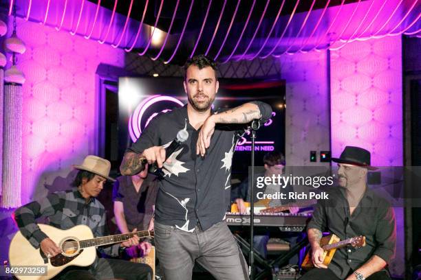 Franky Perez and Dave Kushner perform on stage with the Hellcat Saints at An Evening With Rhonda's Kiss Charity at Beauty & Essex on October 18, 2017...