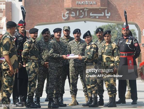 Pakistan Raz Ele2 Indian Border Security Force commandant Sudeep presents sweets to ...
