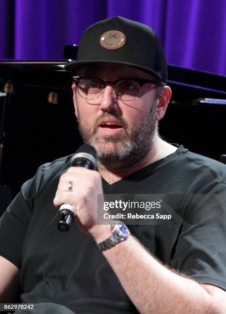 Busbee speaks onstage at Chart Toppers: Songwriters/Producers In-The-Round Featuring Busbee, Dave Bassett, Warren "Oak" Felder, And Teddy Geiger at...
