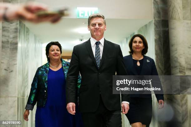 Outgoing Prime Minister Bill English, wife Mary and deputy leader Paula Bennett arrive at a National Party press conference at Parliament on October...