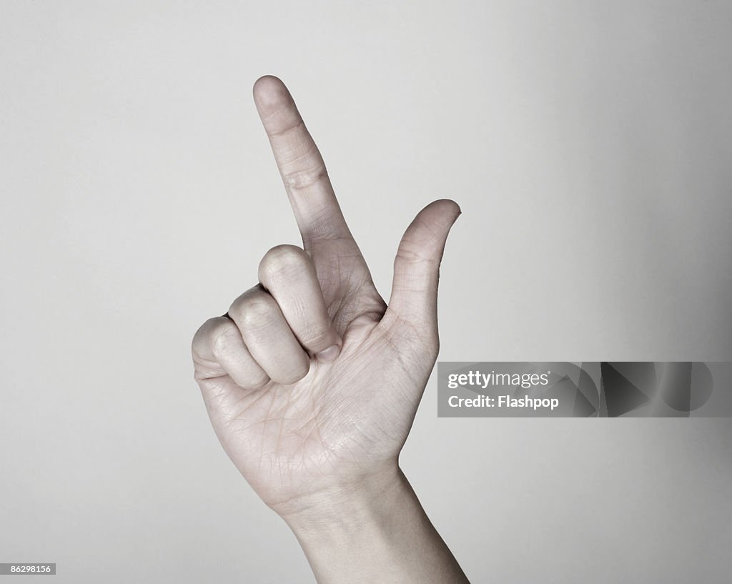 Close-up of finger pointing upwards