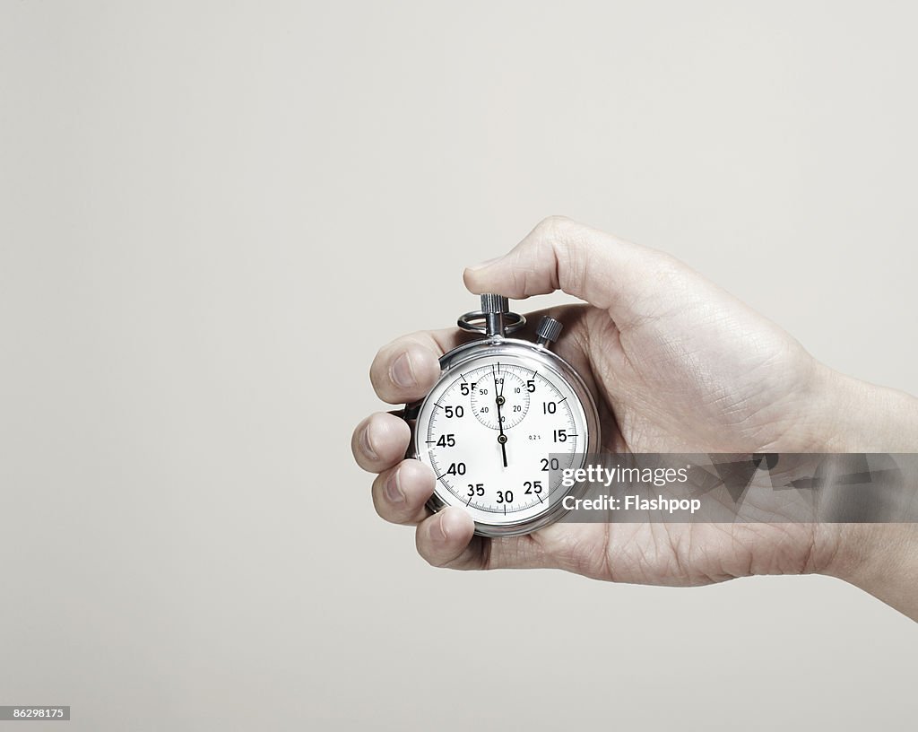 Close-up of hand holding a stopwatch 