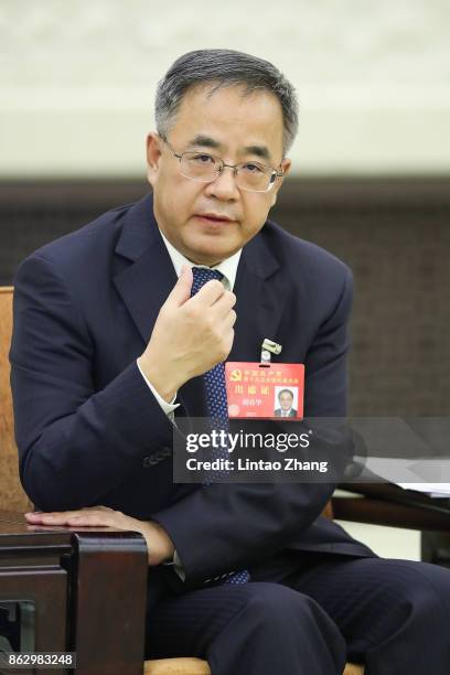 Hu Chunhua, Secretary of the CPC Guangdong Provincial Committee, attends a meeting of the 19th Communist Party Congress at the Great Hall of the...