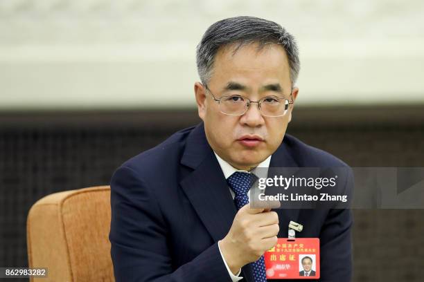 Hu Chunhua, Secretary of the CPC Guangdong Provincial Committee, attends a meeting of the 19th Communist Party Congress at the Great Hall of the...