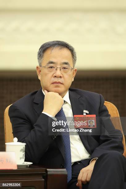 Hu Chunhua, Secretary of the CPC Guangdong Provincial Committee, attends a meeting of the 19th Communist Party Congress at the Great Hall of the...