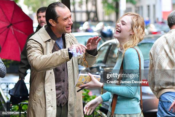 Jude Law and Elle Fanning seen on location for Woody Allen's untitled movie on October 18, 2017 in New York City.