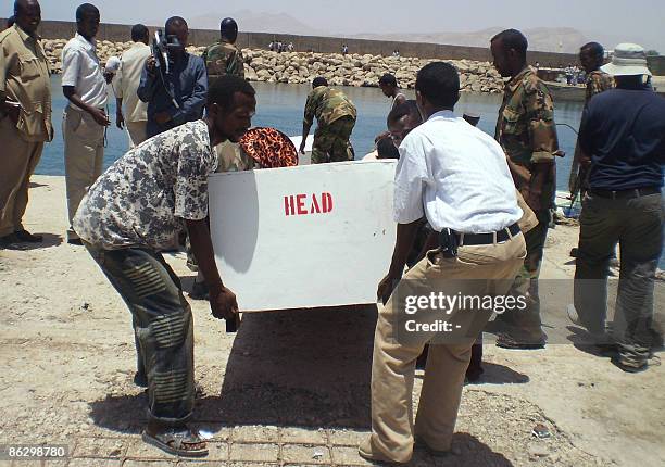 Marine forces in Puntland receive on April 30, 2009 two coffins containing the remains of slain Somali pirates at the northern port town of Bosasso....