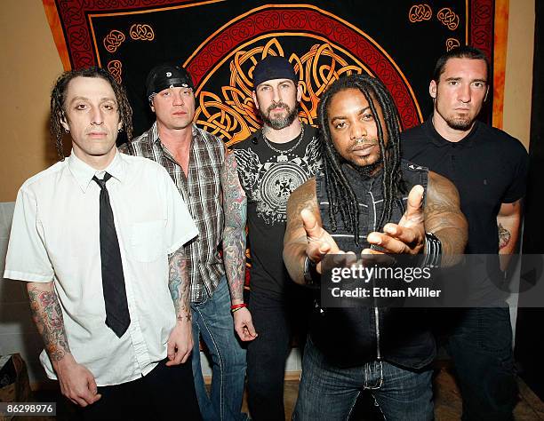 Sevendust drummer Morgan Rose, bassist Vince Hornsby, guitarist John Connolly, singer Lajon Witherspoon and guitarist Clint Lowery appear backstage...