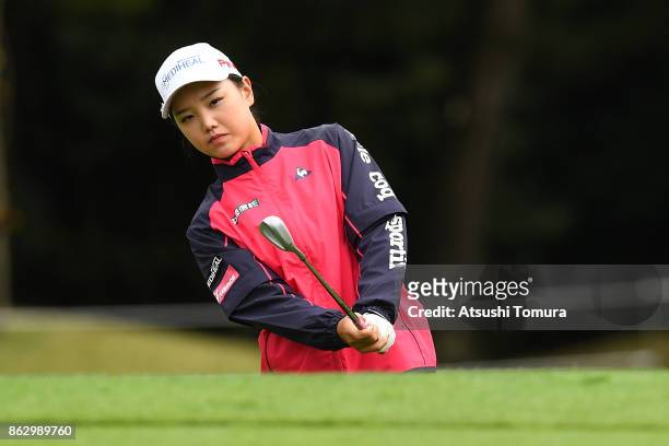 Yuting Seki of China chips onto the 18th green during the first round of the Nobuta Group Masters GC Ladies at the Masters Golf Club on October 19,...