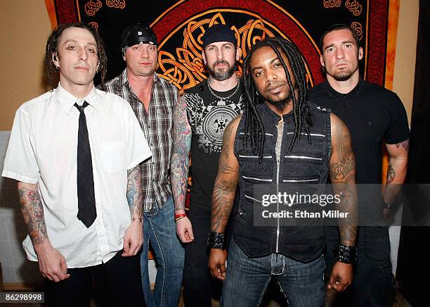 Sevendust drummer Morgan Rose, bassist Vince Hornsby, guitarist John Connolly, singer Lajon Witherspoon and guitarist Clint Lowery appear backstage...