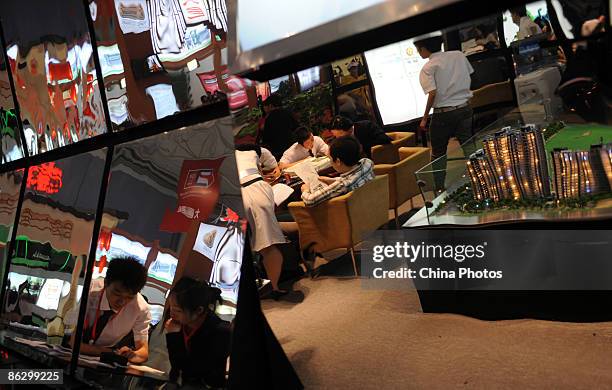 Visitors attend the 33rd Chengdu Real Estae Spring Fair at the new convention center on April 30, 2009 in Chengdu of Sichuan Province, China. The...