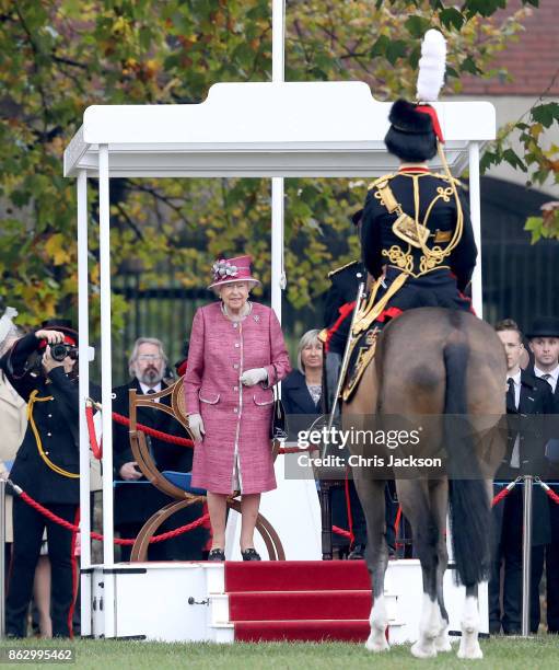 Queen Elizabeth II reviews the King's Troop Royal Horse Artillery during their 70th anniversary parade at Hyde Park on October 19, 2017 in London,...