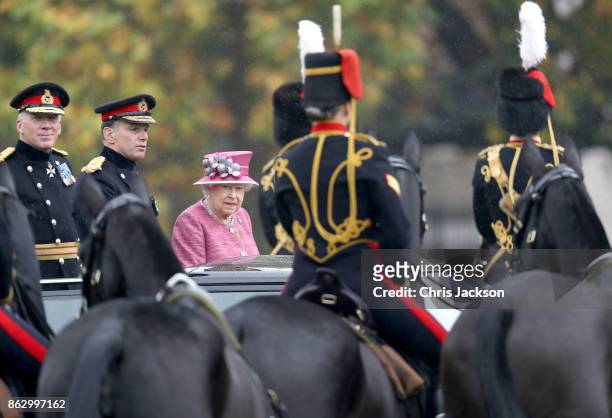 Queen Elizabeth II reviews the King's Troop Royal Horse Artillery during their 70th anniversary parade at Hyde Park on October 19, 2017 in London,...