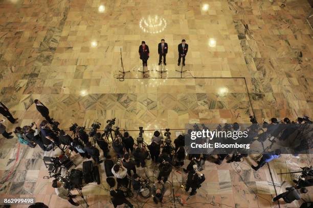 Members of the media gather for a briefing at the Great Hall of the People during the 19th National Congress of the Communist Party of China in...