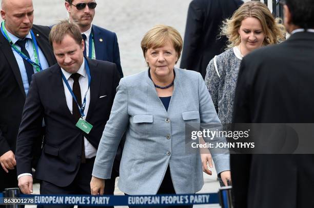 Germany's Chancellor Angela Merkel arrives at a meeting of the European People's Party in Brussels, on October 19, 2017 on the side of the first day...
