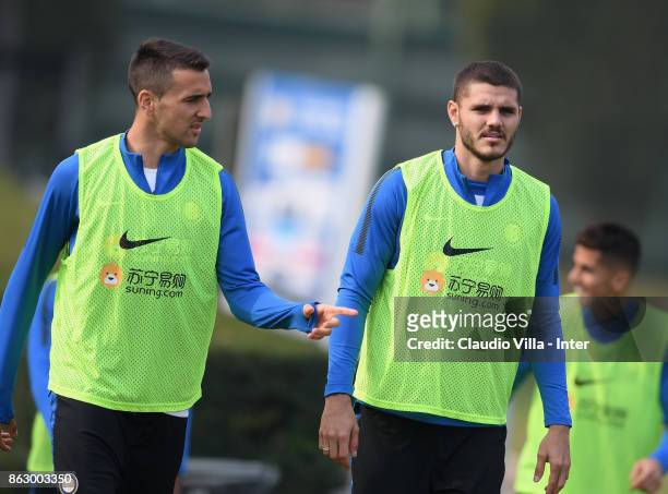 Matias Vecino and Mauro Icardi of FC Internazionale chat during the training session at Suning Training Center at Appiano Gentile on October 19, 2017...