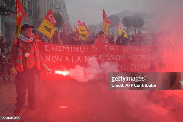 Railway workers march a demonstration called by the CGT workers' union against the French president's labour law reforms, on October 19, 2017 in...
