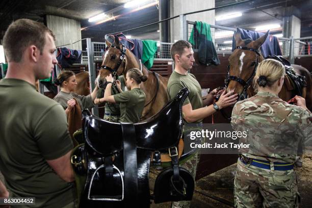 Soldiers from the King's Troop Royal Horse Artillery prepare at Wellington Barracks ahead of their 70th anniversary parade on October 19, 2017 in...