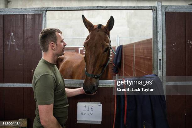 Soldiers from the King's Troop Royal Horse Artillery prepare the horses at Wellington Barracks ahead of their 70th anniversary parade on October 19,...