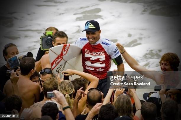 Kelly Slater of the United States celebrates his win during the Billabong Pipeline Masters on December 12, 2008 in North Shore, Hawaii.