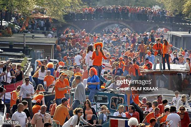 Thousands of people celebrate Queensday on boats in the canals of Amsterdam, on April 30, 2009. A car slammed into Dutch Queensday festival-goers in...