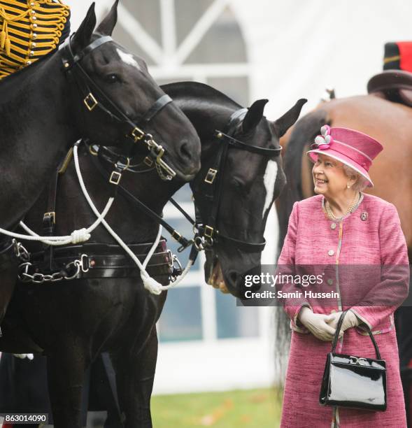 Queen Elizabeth II reviews The King's Troop Royal Horse Artillery on the 70th anniversary at Hyde Park on October 19, 2017 in London, England. The...