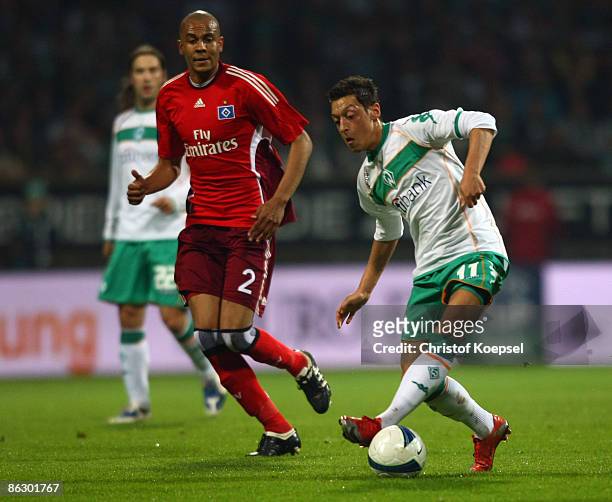 Mesut Oezil of Bremen is chased by Alex Silva of Hamburg during the UEFA Cup Semi Final first leg match between SV Werder Bremen and Hamburger SV at...