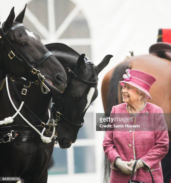 Queen Elizabeth II reviews The King's Troop Royal Horse Artillery on the 70th anniversary at Hyde Park on October 19, 2017 in London, England. The...