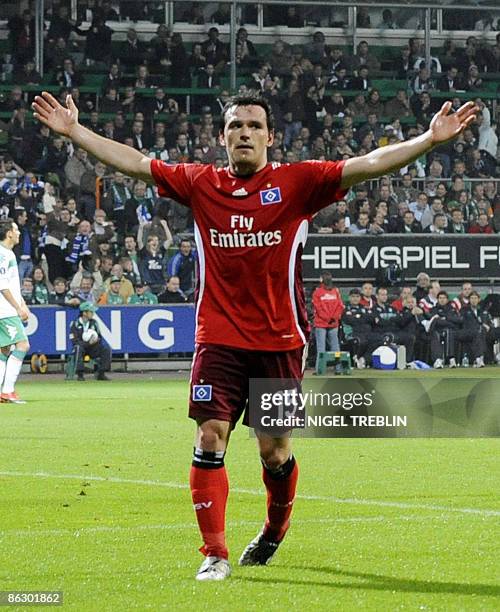 Hamburg's midfielder Piotr Trochowski celebrates after opening the score during the UEFA Cup semi-final football match Werder Bremen vs Hamburger SV...