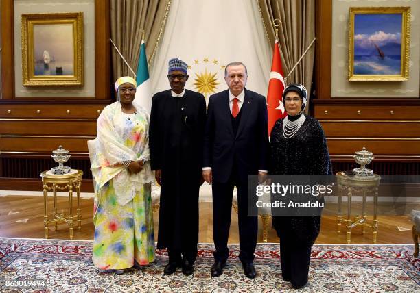 Turkish President Recep Tayyip Erdogan , his spouse Emine Erdogan and Nigerian President Muhammadu Buhari and his spouse Aisha Buhari pose for a...