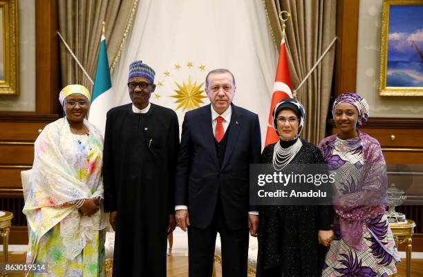 Turkish President Recep Tayyip Erdogan , his spouse Emine Erdogan and Nigerian President Muhammadu Buhari and his spouse Aisha Buhari pose for a...