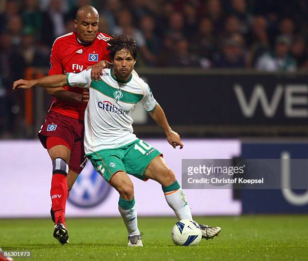 Alex Silva of Hamburg tackles Diego of Werder Bremen during the UEFA Cup Semi Final first leg match between SV Werder Bremen and Hamburger SV at the...