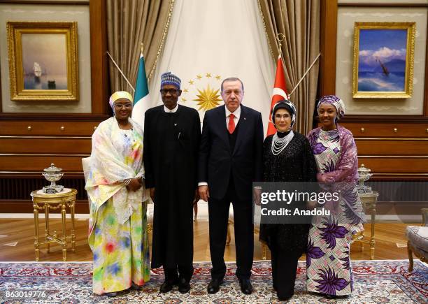 Turkish President Recep Tayyip Erdogan , his spouse Emine Erdogan and Nigerian President Muhammadu Buhari and his spouse Aisha Buhari pose for a...