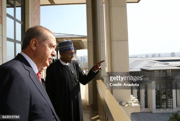 Turkish President Recep Tayyip Erdogan , his spouse Emine Erdogan and Nigerian President Muhammadu Buhari and his spouse Aisha Buhari talk together...