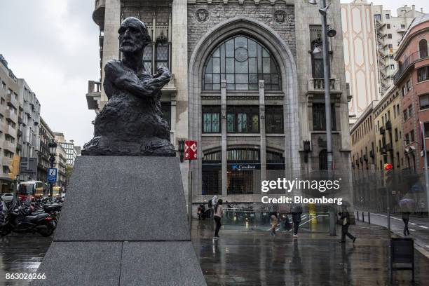 Monument to lawmaker Francesc Cambo by sculptor Victor Ochoa sits on Via Laietana near a CaixaBank SA bank branch in Barcelona, Spain, on Thursday,...