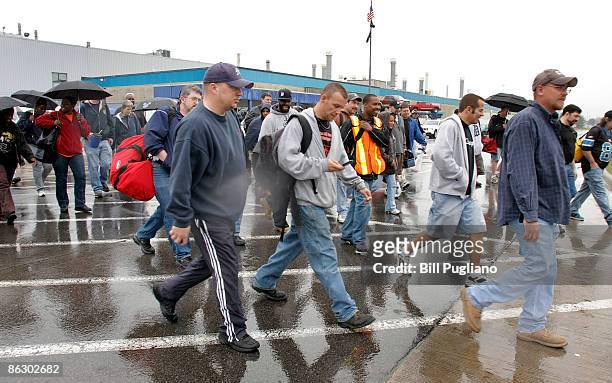 Chrysler workers exit from the Chrysler Warren Truck Assembly Plant April 30, 2009 in Warren, Michigan. Chrysler failed to come to an agreement with...