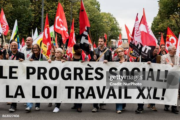 People march behind a banner as thousands gather in the streets of Lyon, France to protest against the labor law at the call of the CGT, the UNEF and...