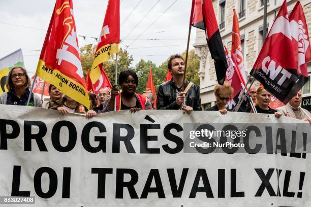 People march behind a banner as thousands gather in the streets of Lyon, France to protest against the labor law at the call of the CGT, the UNEF and...