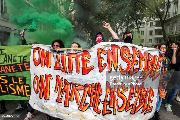 People march behind a banner as thousands gather in the streets of Lyon, France to protest against the labor law at the call of the CGT, the UNEF and...