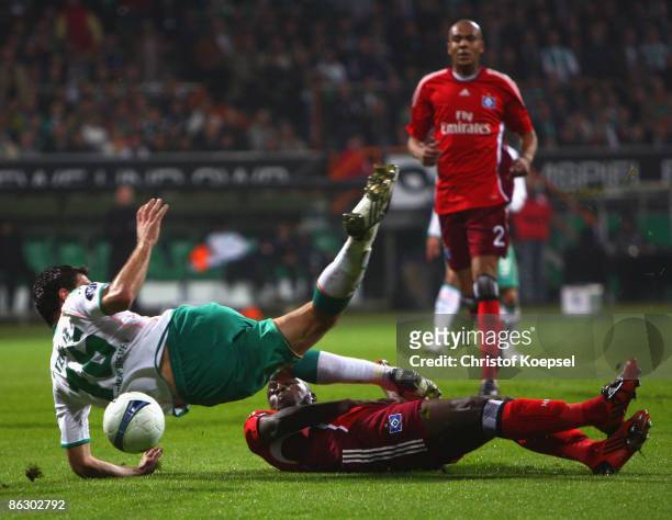 Guy Demel of Hamburg fouls Alexandros Tziolis of Werder Bremen in the penalty area during the UEFA Cup Semi Final first leg match between SV Werder...
