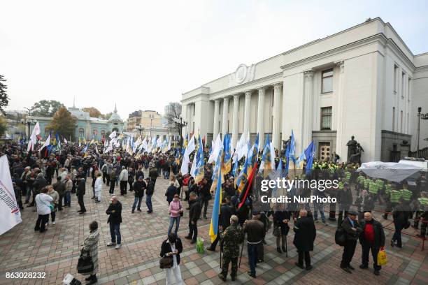 People hold a rally in front of Ukrainian Parliament in Kyiv, Ukraine, Oct.19, 2017. Dozens Ukrainians set up a tent camp in front of Parliament...