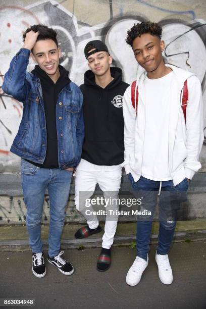 Teen stars and singer Devin Gordon, Daniel Veda and Kevin Alston of the band The Bomb Digz pose for pictures before their concert on October 19, 2017...