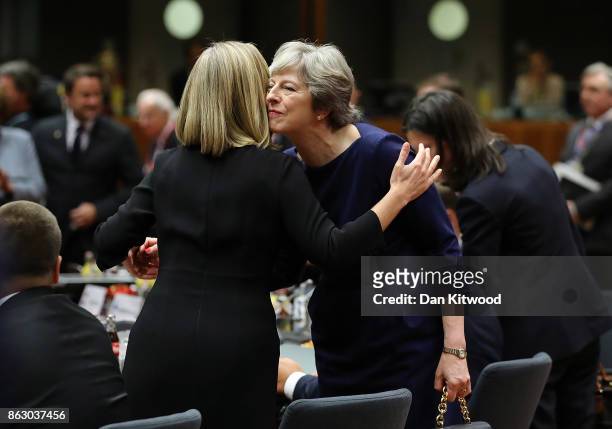 Britain's Prime Minister Theresa May arrives for a round table meeting on October 19, 2017 in Brussels, Belgium. Under discussion are the Iran...