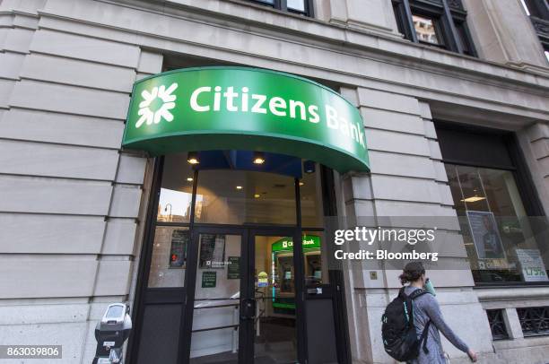 Pedestrian passes in front of a Citizens Financial Group Inc. Bank branch in downtown Boston, Massachusetts, U.S., on Tuesday, Oct. 10, 2017....