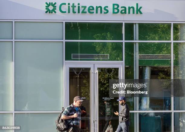 Pedestrians pass in front of a Citizens Financial Group Inc. Bank branch in downtown Boston, Massachusetts, U.S., on Tuesday, Oct. 10, 2017. Citizens...