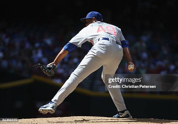 Relief pitcher Carlos Marmol of the Chicago Cubs pitches against the Arizona Diamondbacks during the game at Chase Field on April 29, 2009 in...